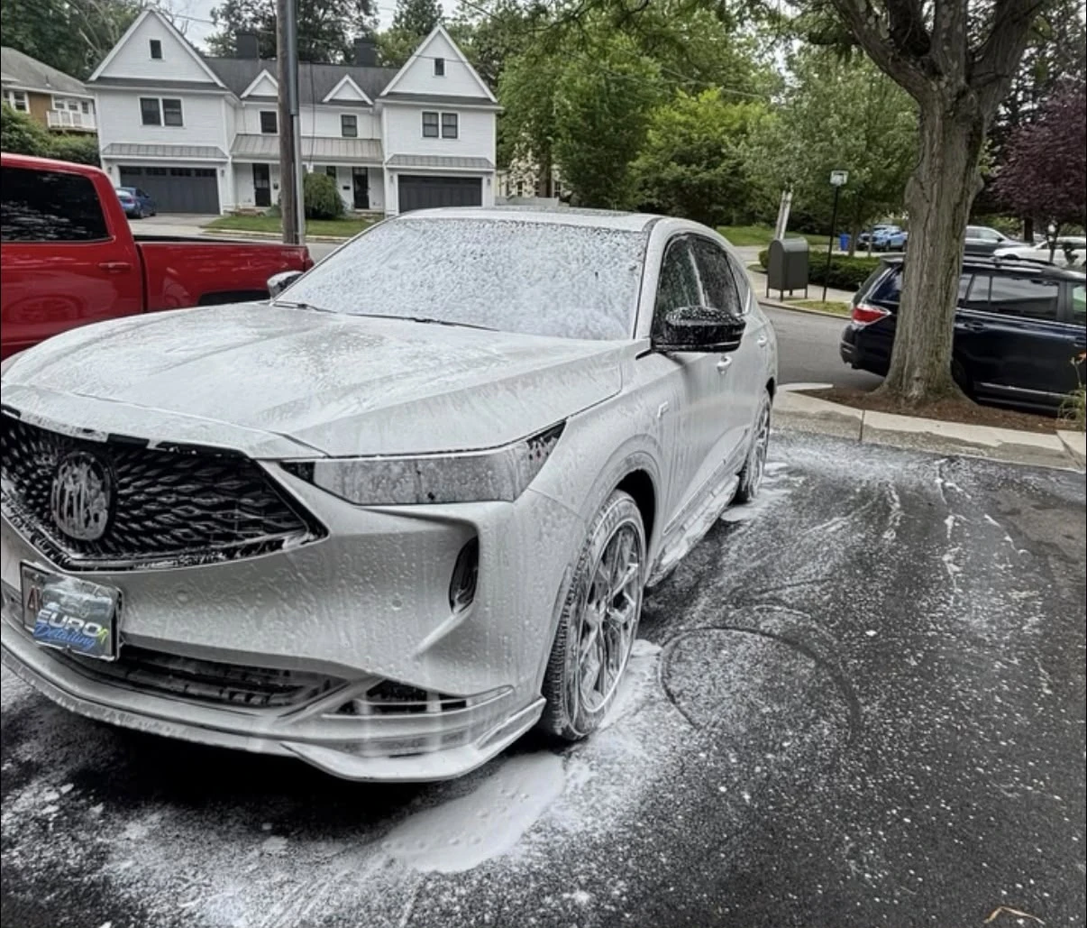 Acura MDX covered in snow foam during a mobile exterior wash in Newton, MA