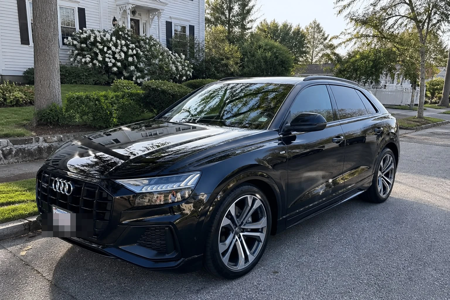 Glossy black Audi Q8 with a freshly waxed, deep-shine finish, Newton MA