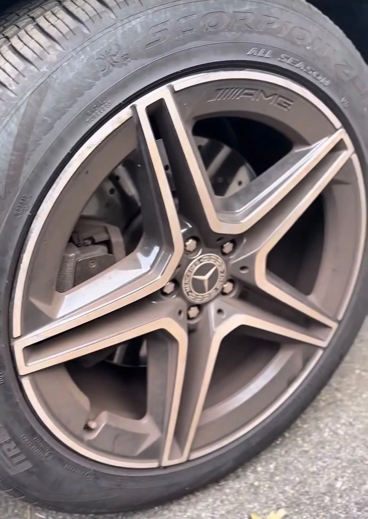 Close-up of a cleaned Mercedes-AMG alloy wheel and tire after detailing, Newton MA