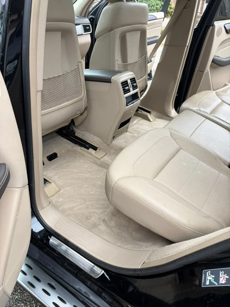 Detailed beige leather seats after an interior detail in Newton, MA