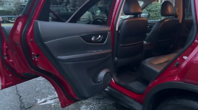 Video of a Nissan Rogue rear door open showing a cleaned and conditioned interior, Newton MA